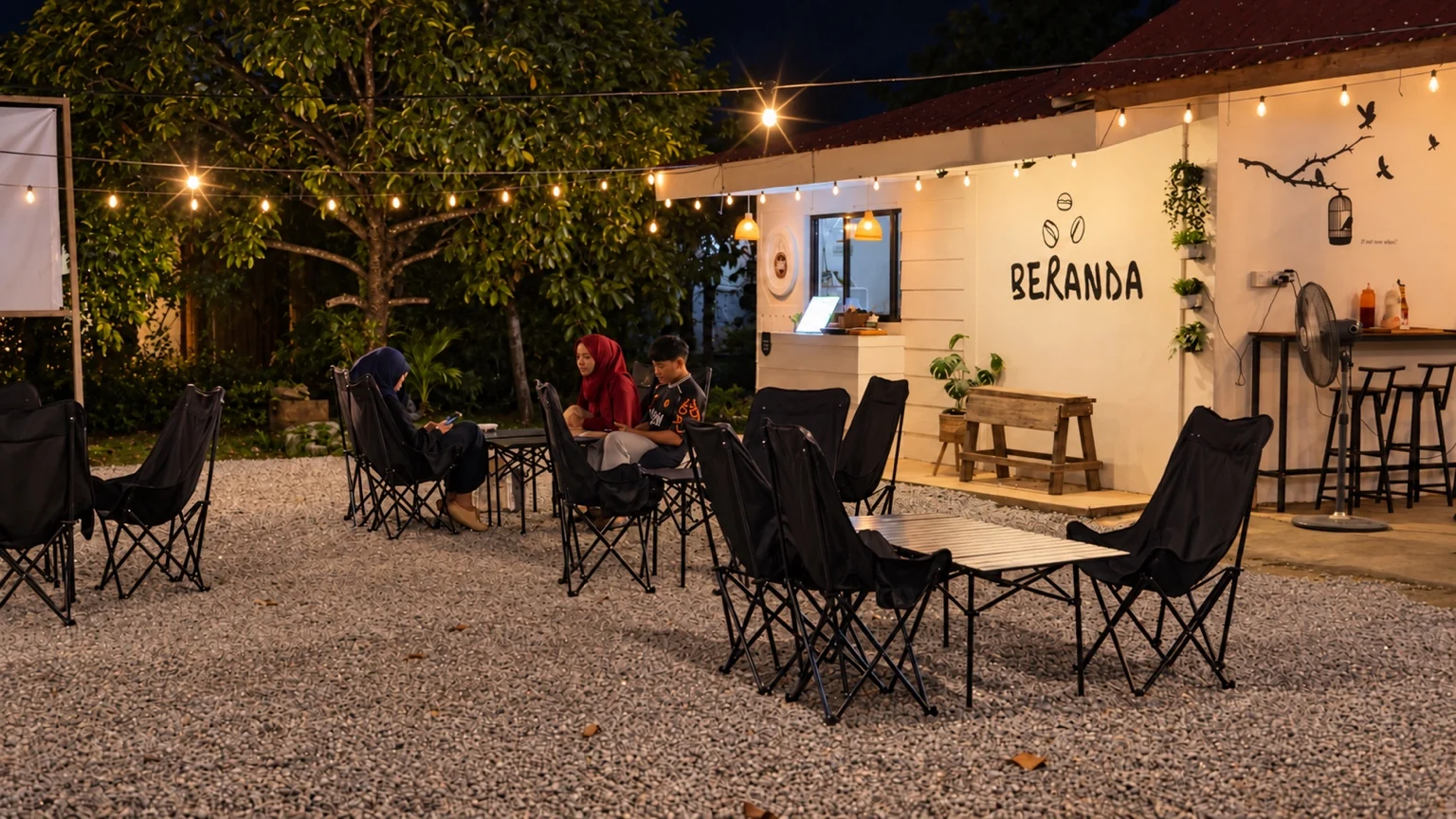 Guests enjoying an evening at Beranda’s outdoor seating in Kampung Tualang